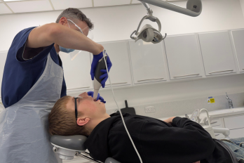 Patient Harry Underhill with consultant Ian Edwards and oral scanner.