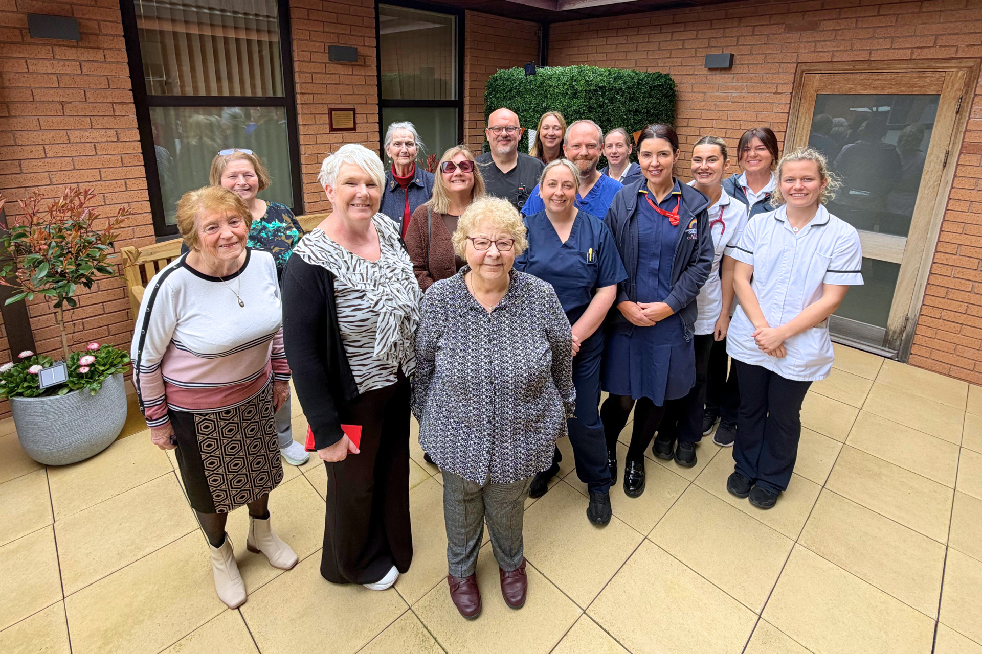 Group photo on the balcony with staff
