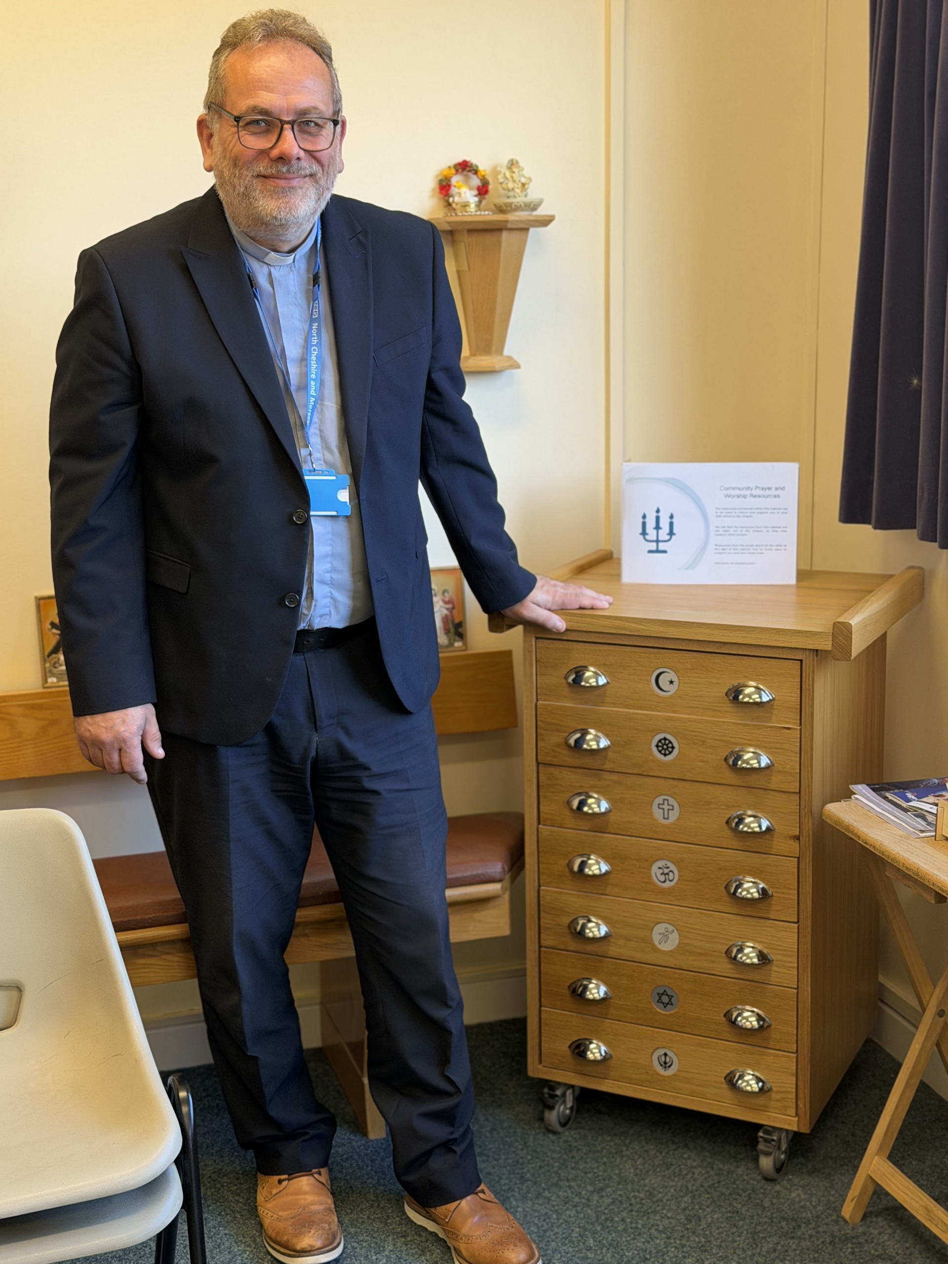 Rev, John with multi-faith cabinet