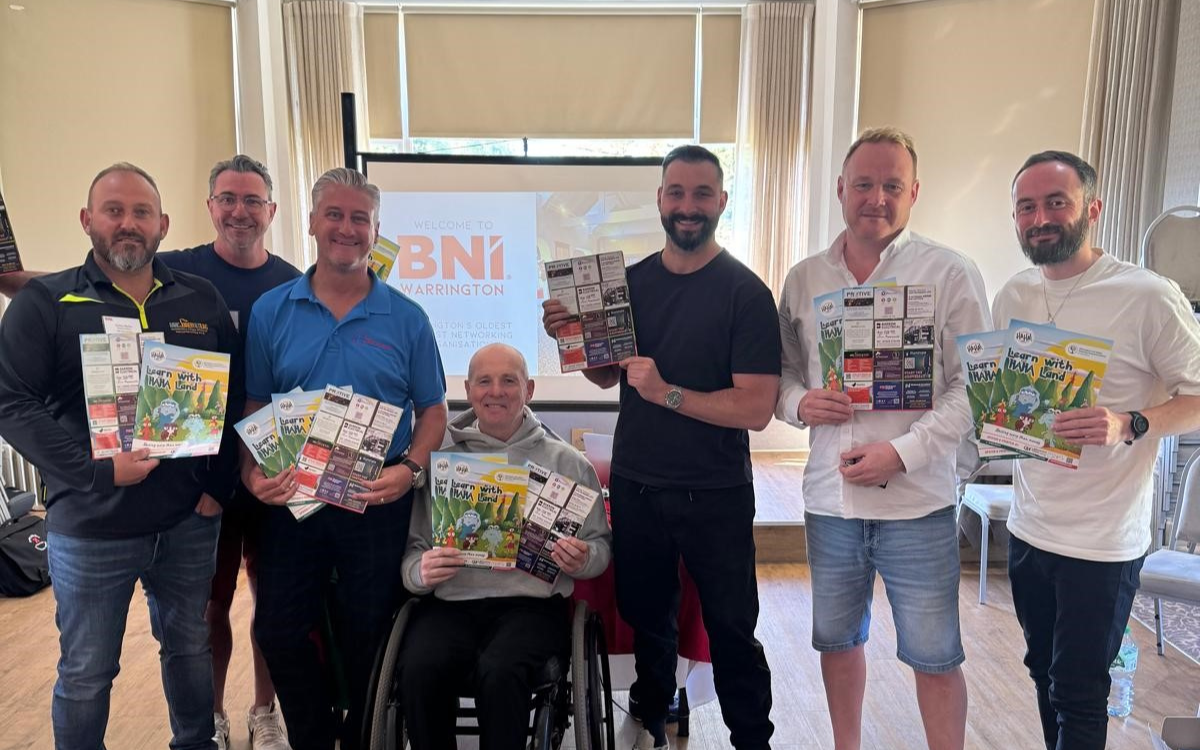 Local Warrington businesses holding activity books which they all sponsored for children at Warrington Hospital.