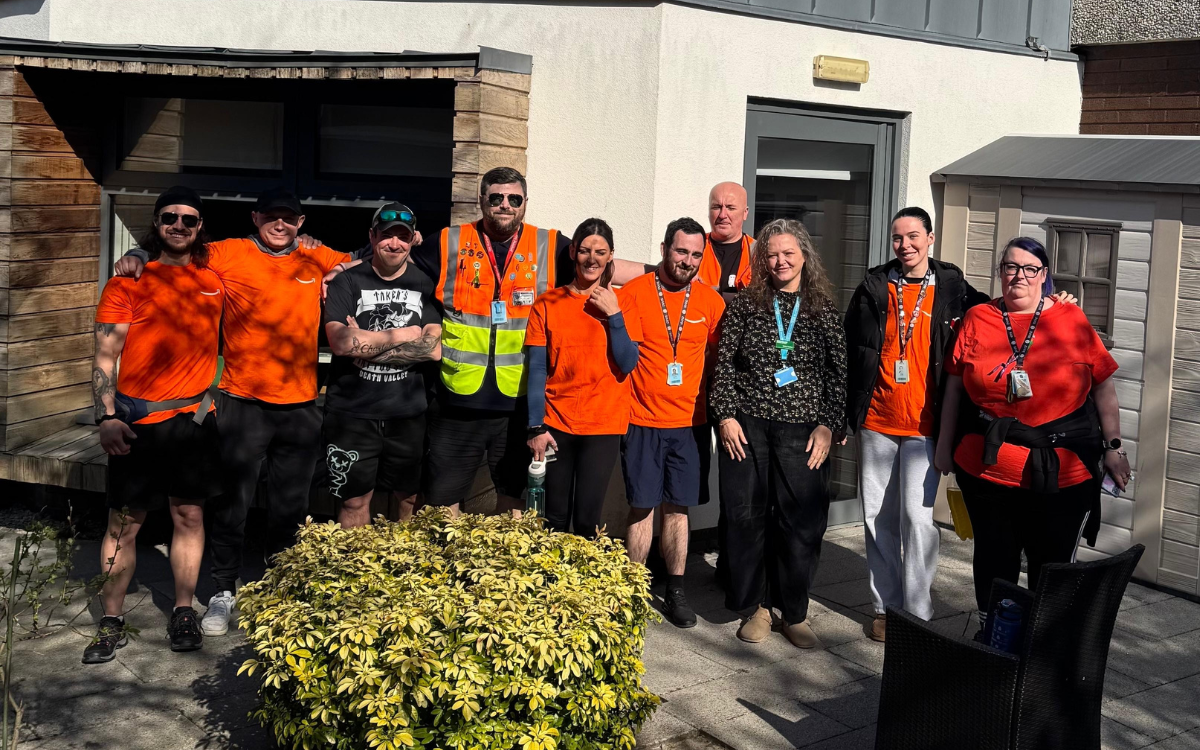 Corporate group volunteering to do gardening at Halton Hospital.