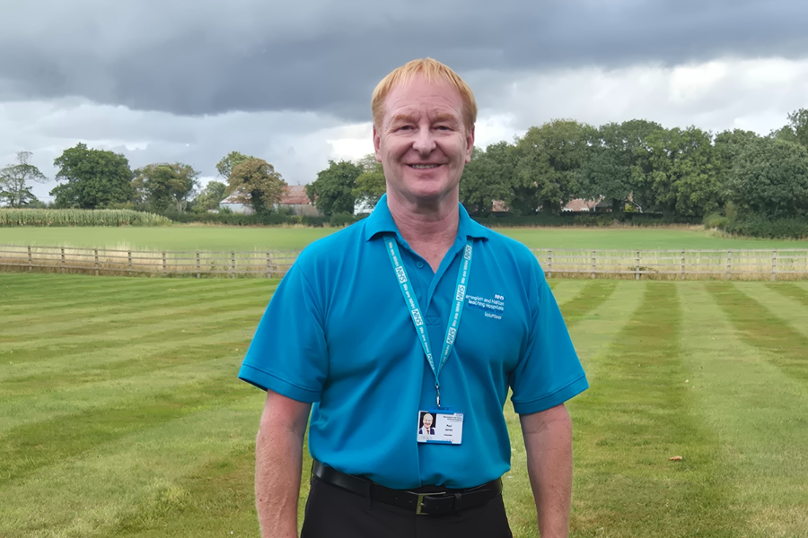Paul in a blue volunteers t-shirt.