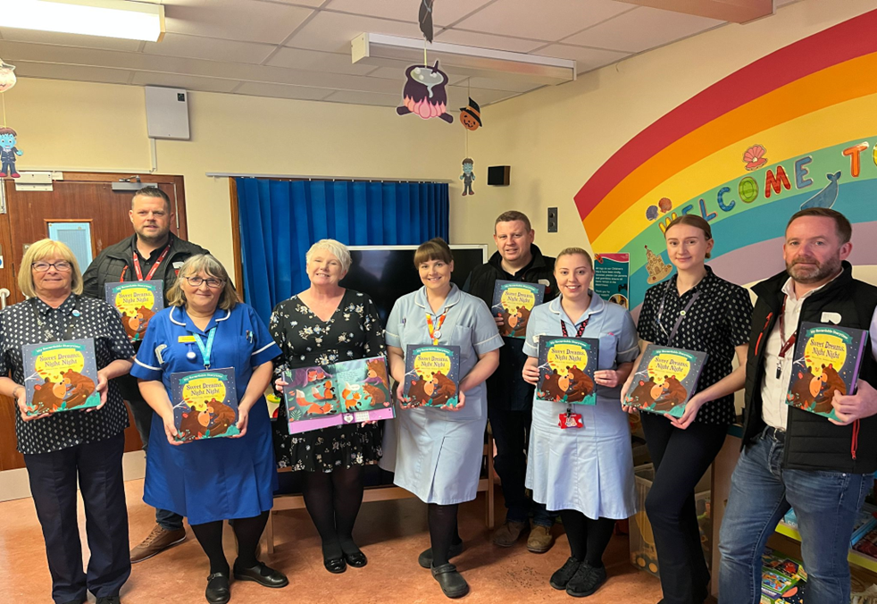 Laurence presenting donated books to the Children's Ward at Warrington Hospital.