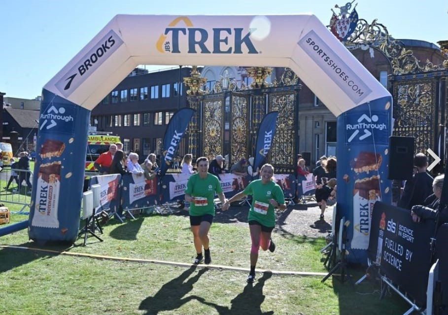 Fundraisers finishing the Warrington Running Festival